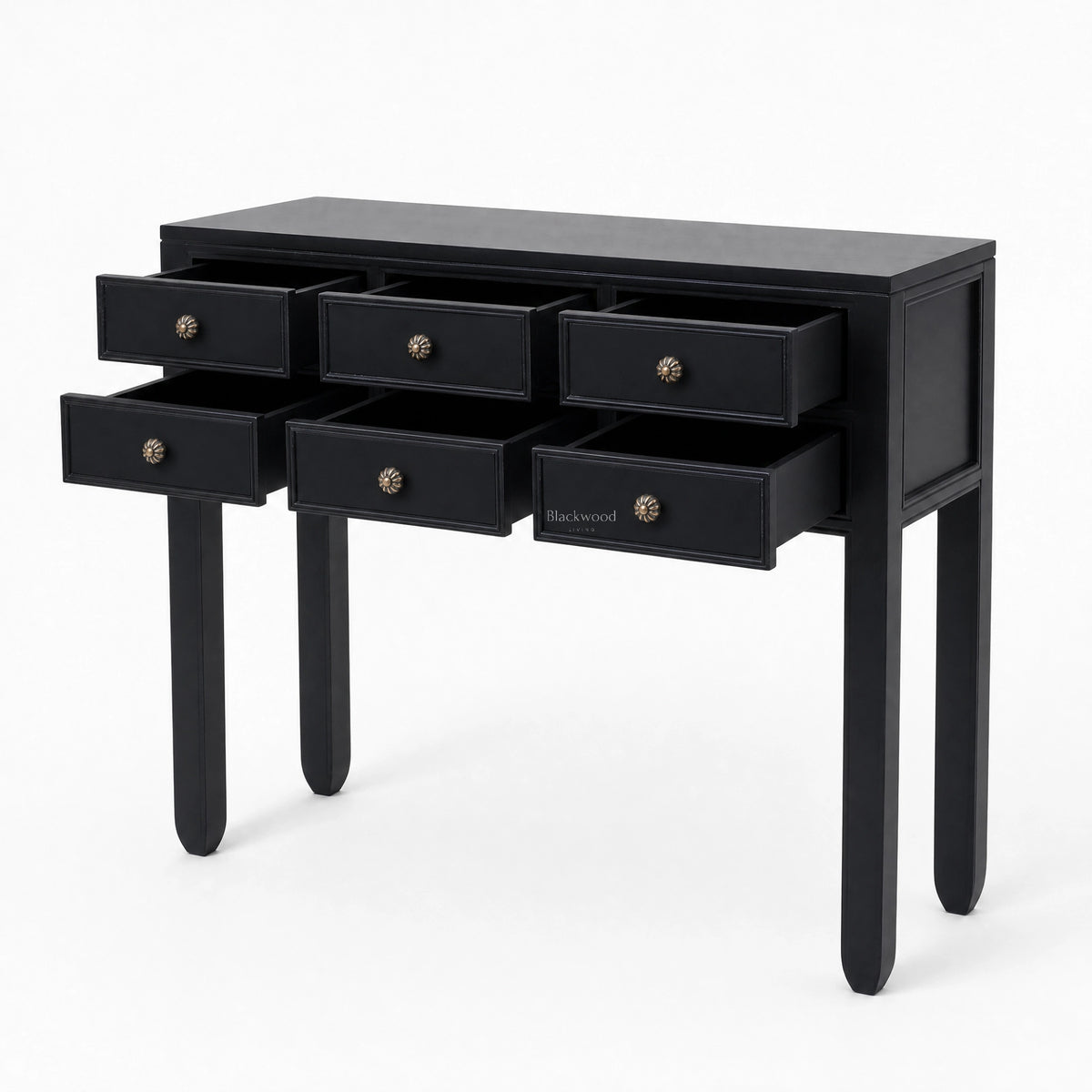 Black Penang hall table with slender legs and six open drawers featuring warm-toned metal handles for entryway storage.