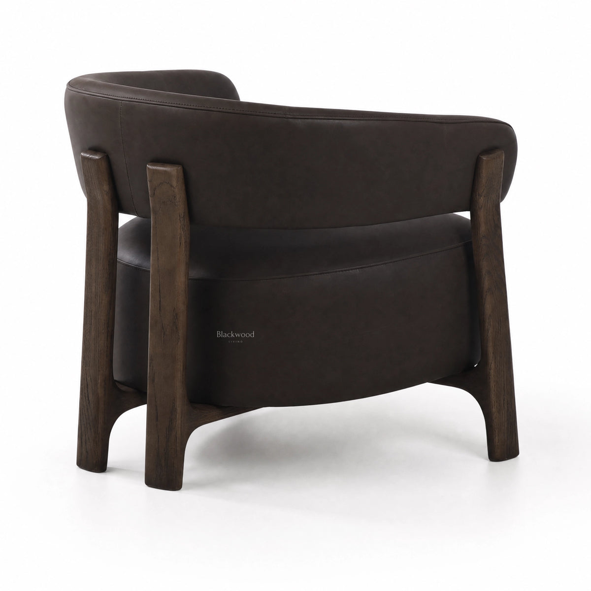 Rear view of black leather Alderton armchair featuring a curved back and solid ash timber frame with sturdy legs.