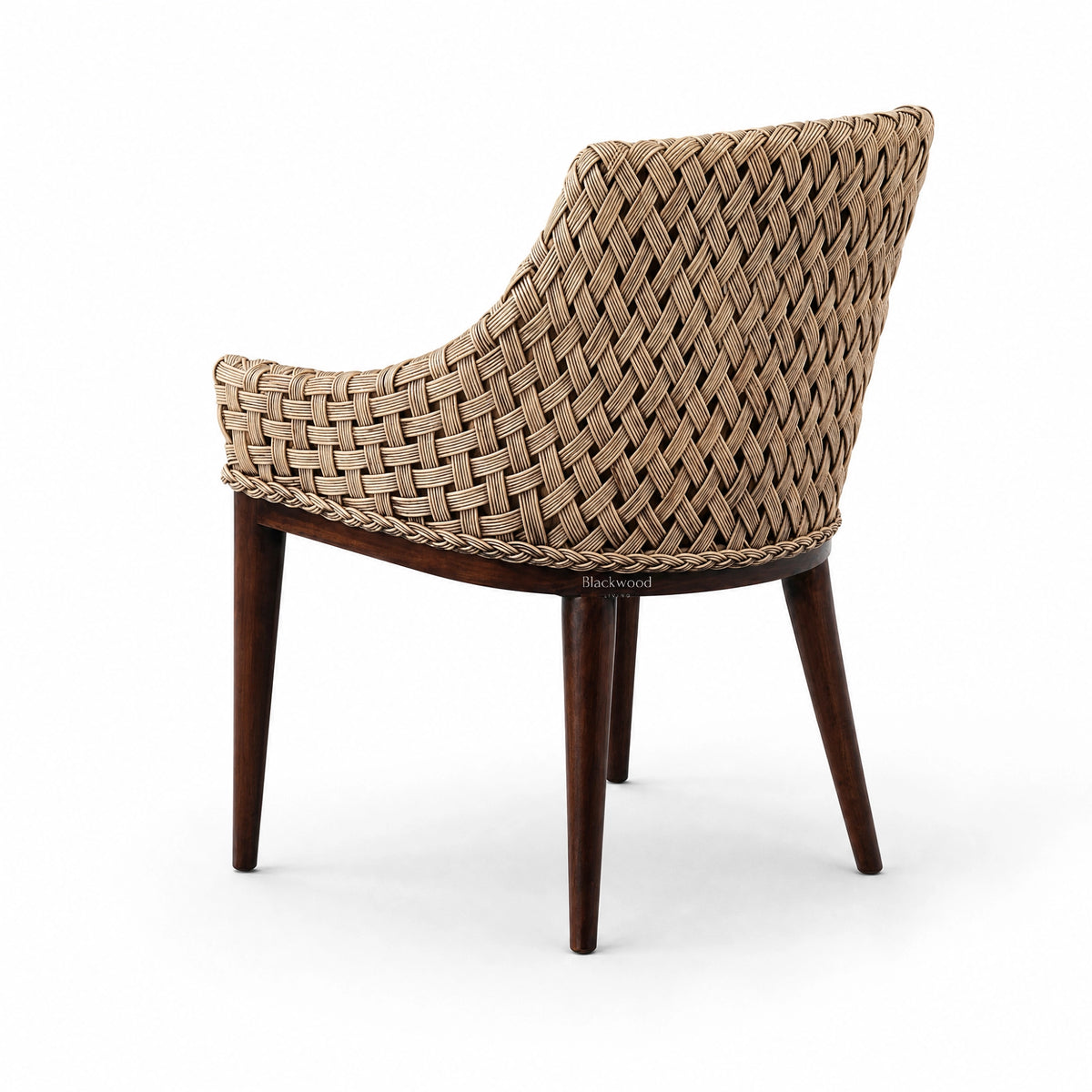 Back view of Malabar dining chair featuring solid timber legs and hand-woven rattan back and arms.