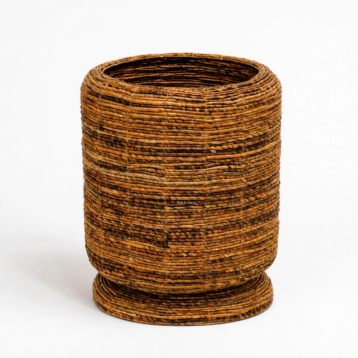 Ceylon Planter medium featuring woven banana leaf construction and rounded form for tropical interior warmth.