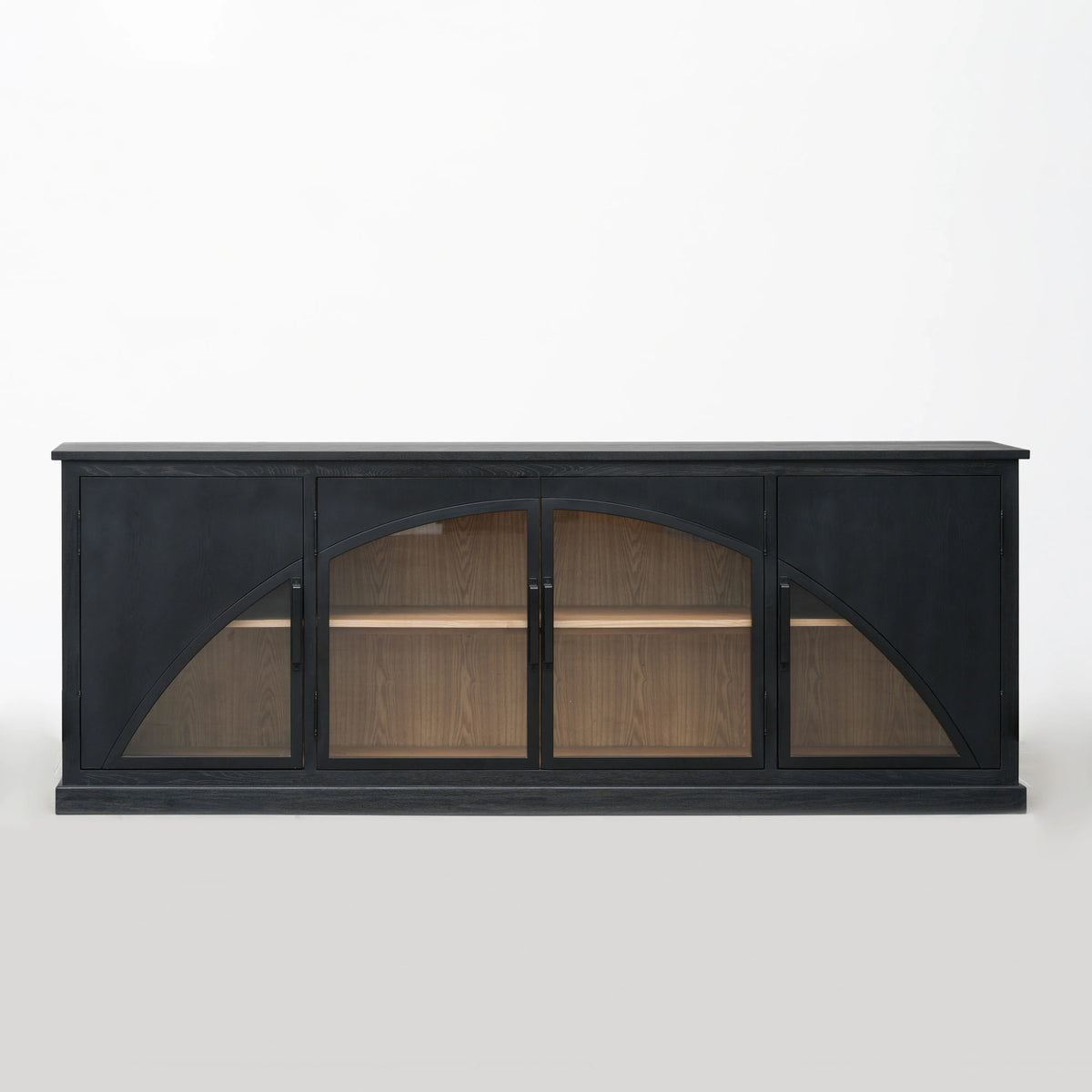 Archway Sideboard in deep black with arched doors, warm timber interior; elm plywood veneer.