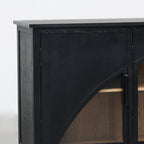 Black archway sideboard with arched glass door detail, deep charcoal finish, and warm timber interior shelves.