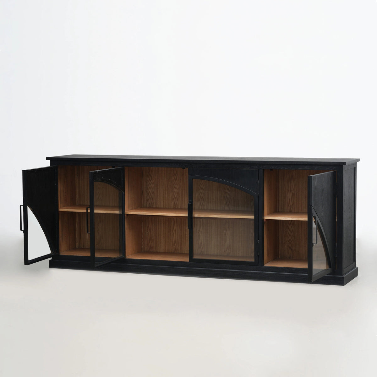 Dark black sideboard with arched doors open to reveal warm timber interior shelves and architectural design.