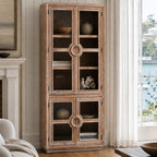 Tall distressed elm cabinet with glazed doors, distinctive circular nautical handles, and coastal character.