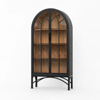 Tall arched cabinet with glazed doors, dark metal frame, and warm wood interior on a scenic metal base.