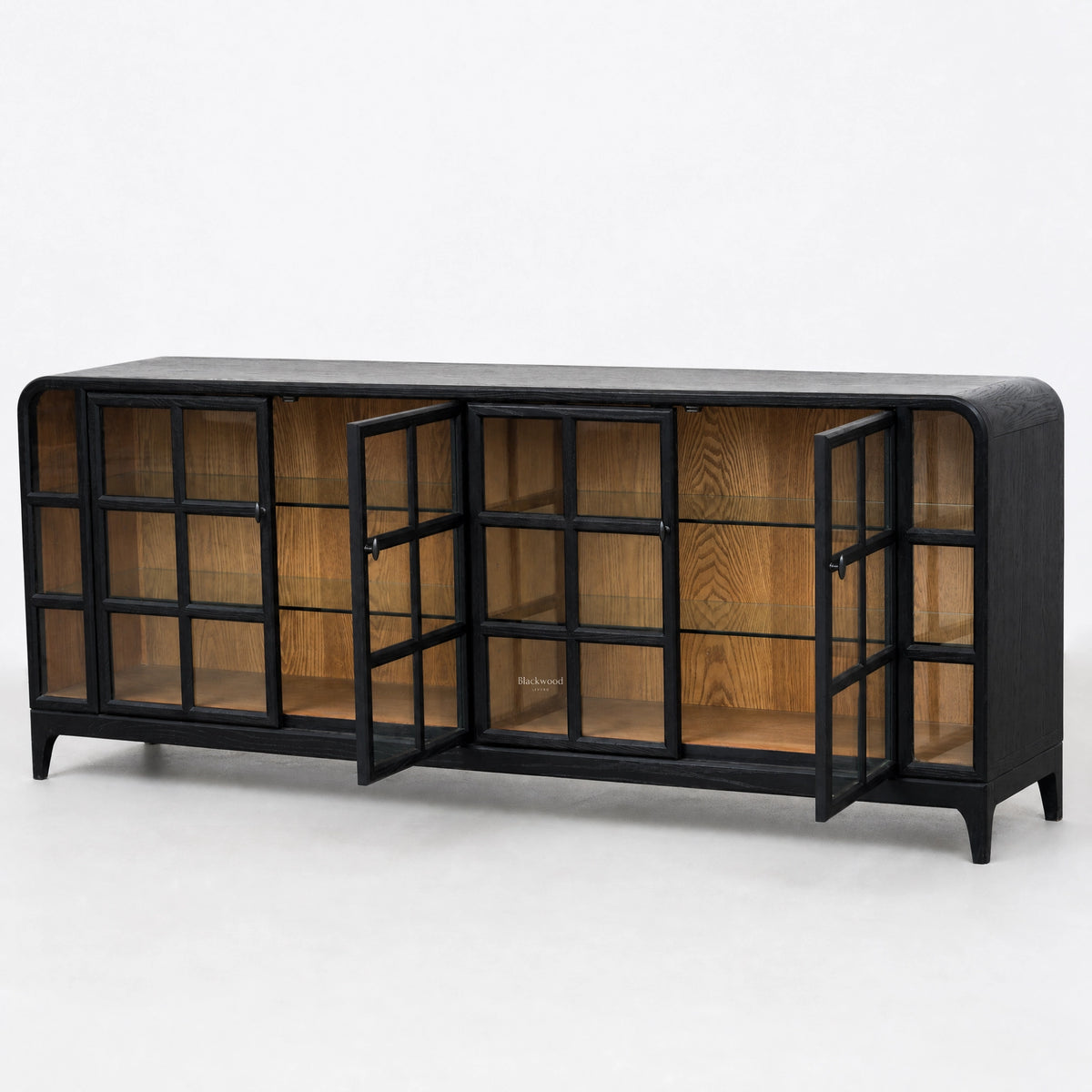 Black ash sideboard with glazed grid doors open to reveal natural timber interior and glass shelves.