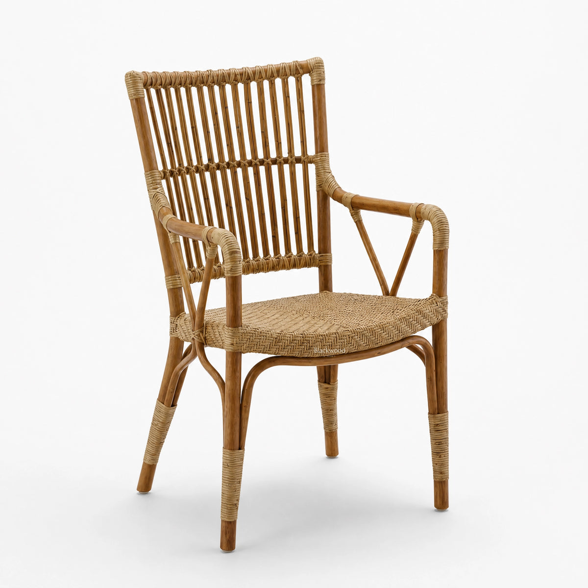 Handmade Indonesian rattan armchair featuring a braided seat, structured vertical-back, and traditional wicker binding.