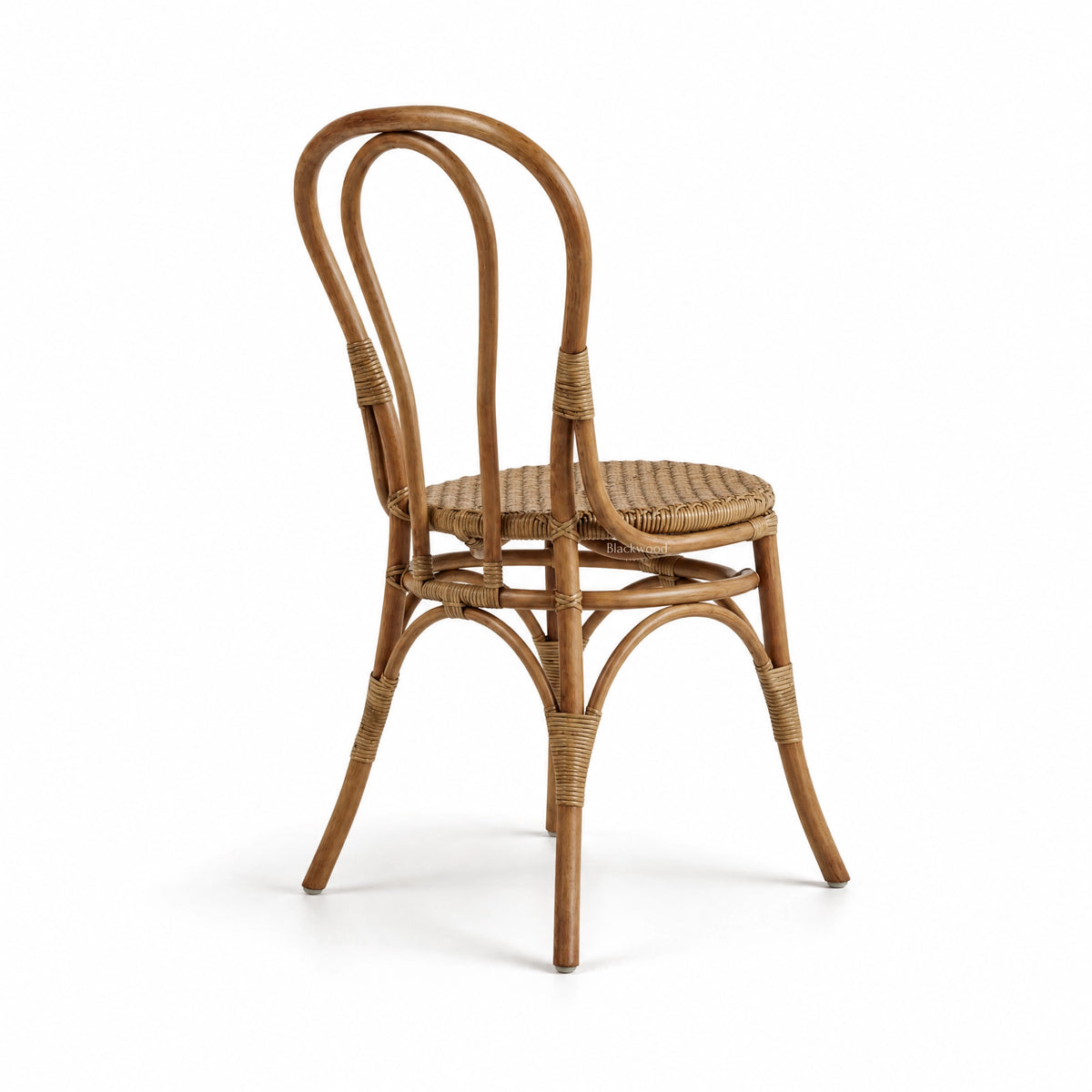 Back view of Sika Originals Lulu rattan side chair featuring a curved bentwood frame and woven seat.