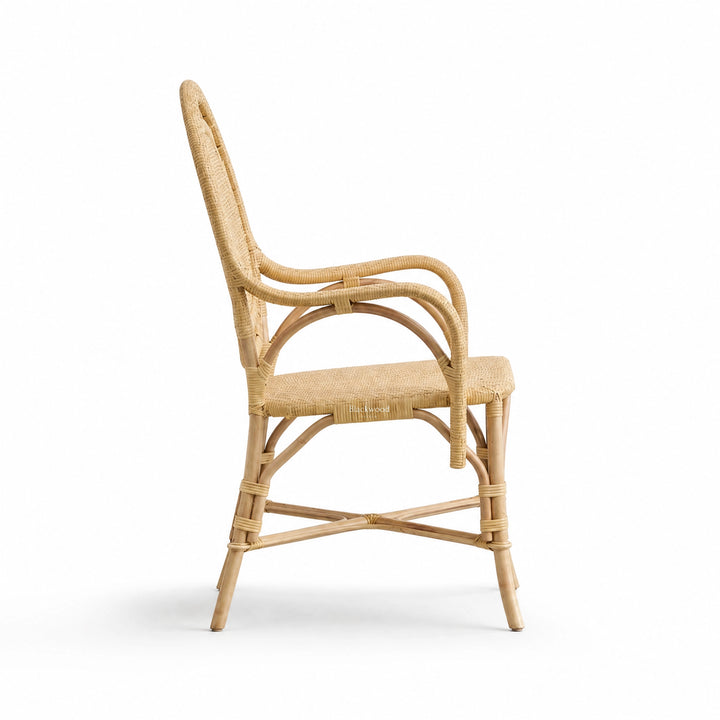 Handcrafted rattan armchair featuring a rounded back, curved arms, and intricate woven panels with detailed bind joints.