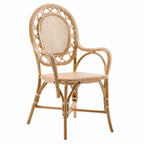 Handcrafted rattan armchair featuring a rounded oval back, intricate woven panels, and curved armrests for graceful traditional style.