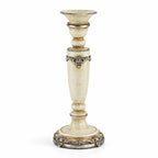 Tall antique cream candle holder with turned silhouette and silver ornamental detailing, featuring classical European design.