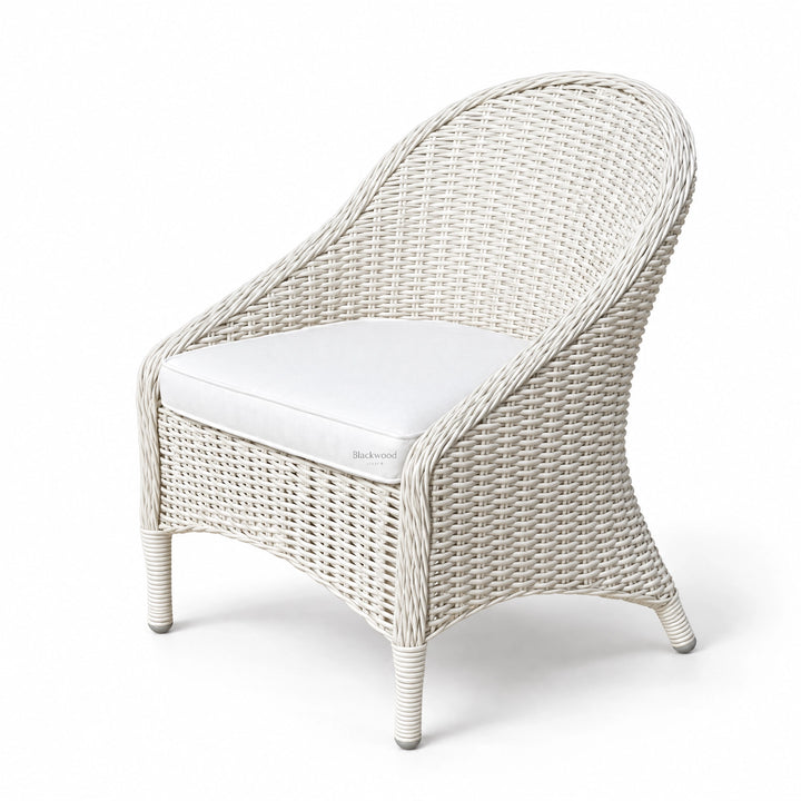White outdoor armchair with sweeping woven rattan profile, crisp finish, and white cushion on lightweight铝 base.