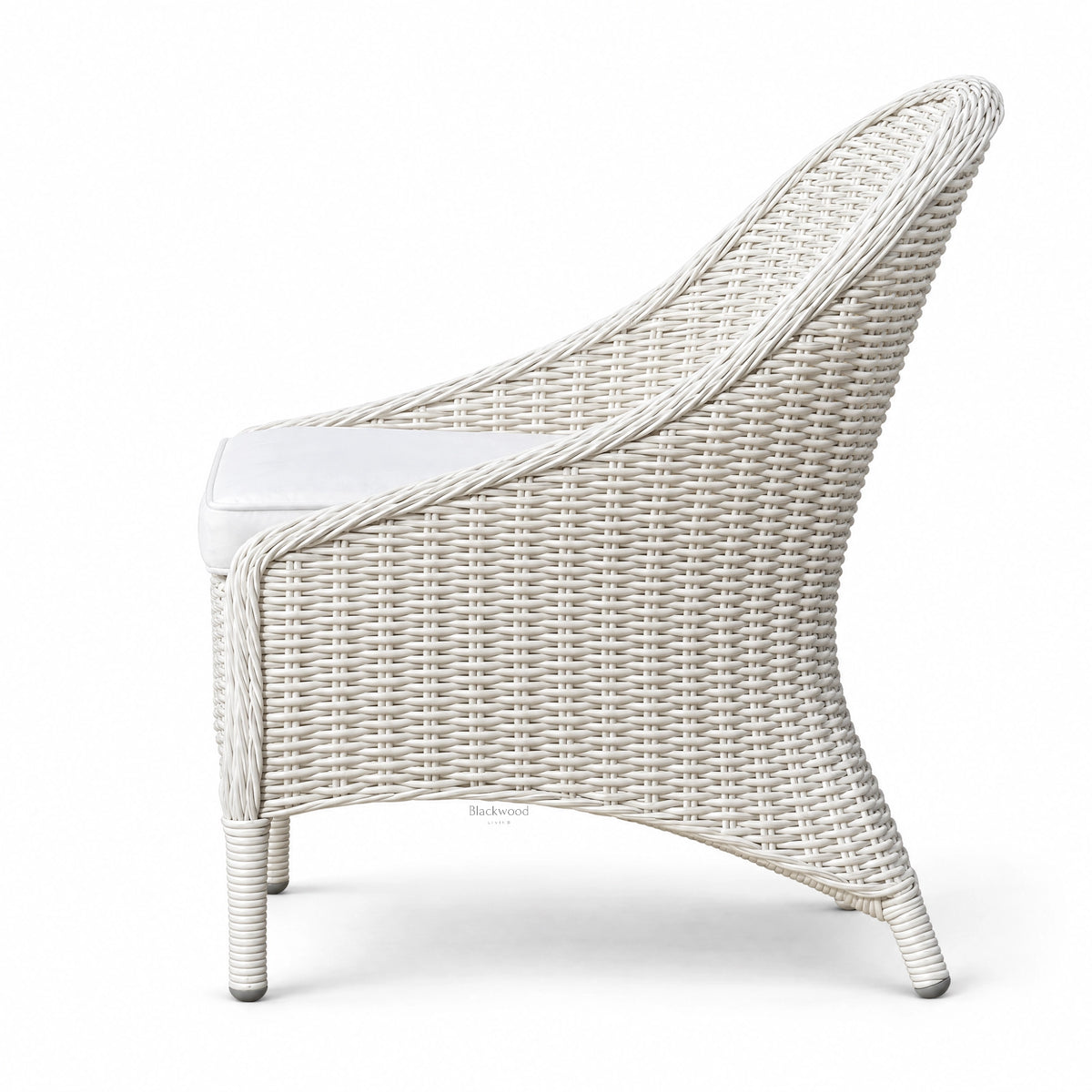 White outdoor rattan chair with sweeping woven profile and crisp white finish, featuring a Mediterranean character and aluminum base.