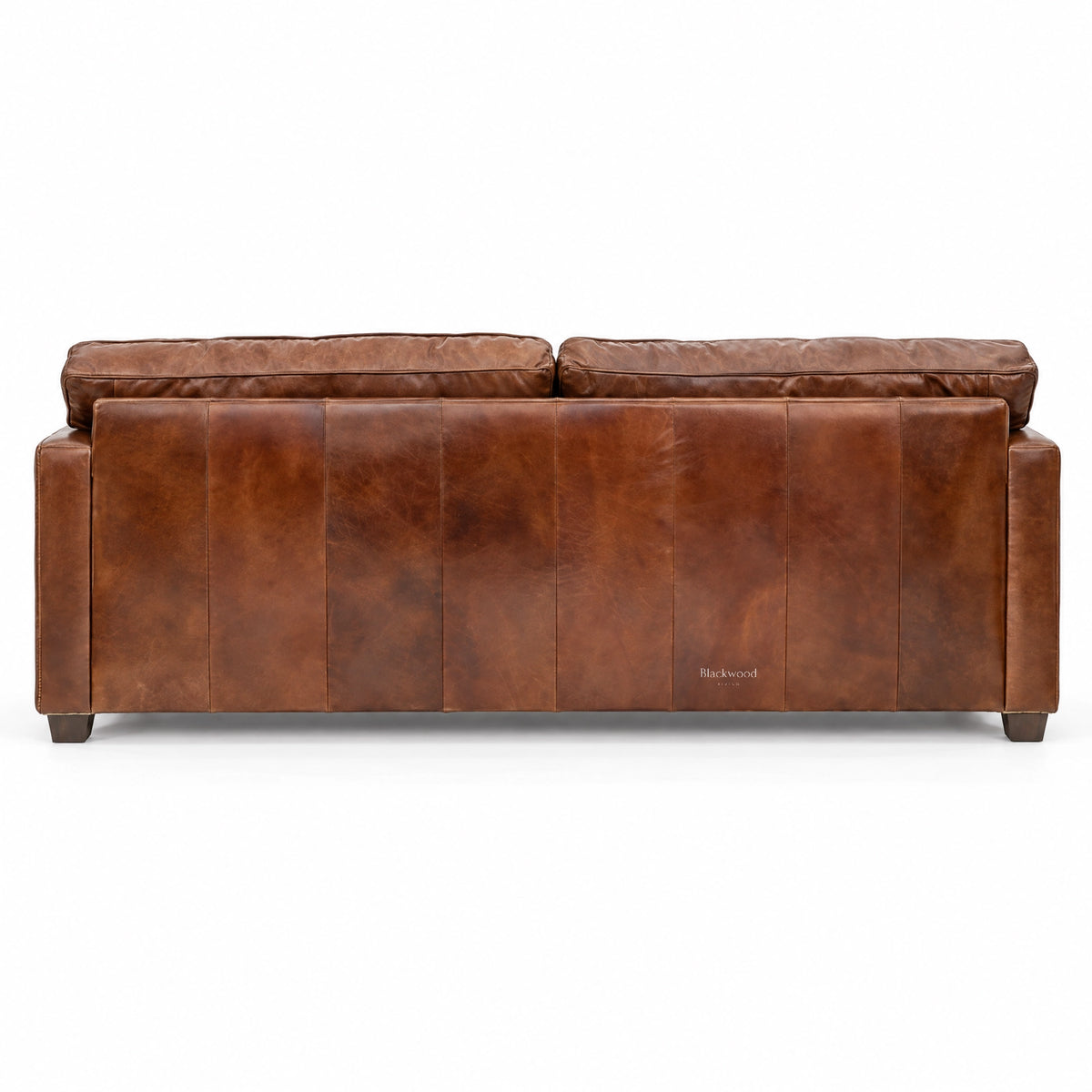 Back view of a brown leather 3-seat sofa featuring vertical stitching and a rustic, lived-in texture.