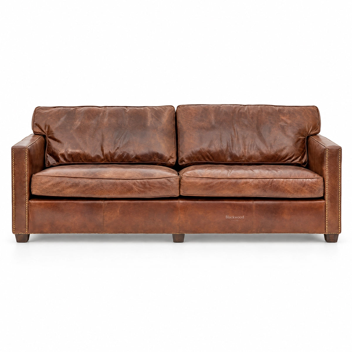 Brown leather 3-seat sofa with nailhead trim, featuring a distressed finish and plush cushions for a rustic, cozy aesthetic.