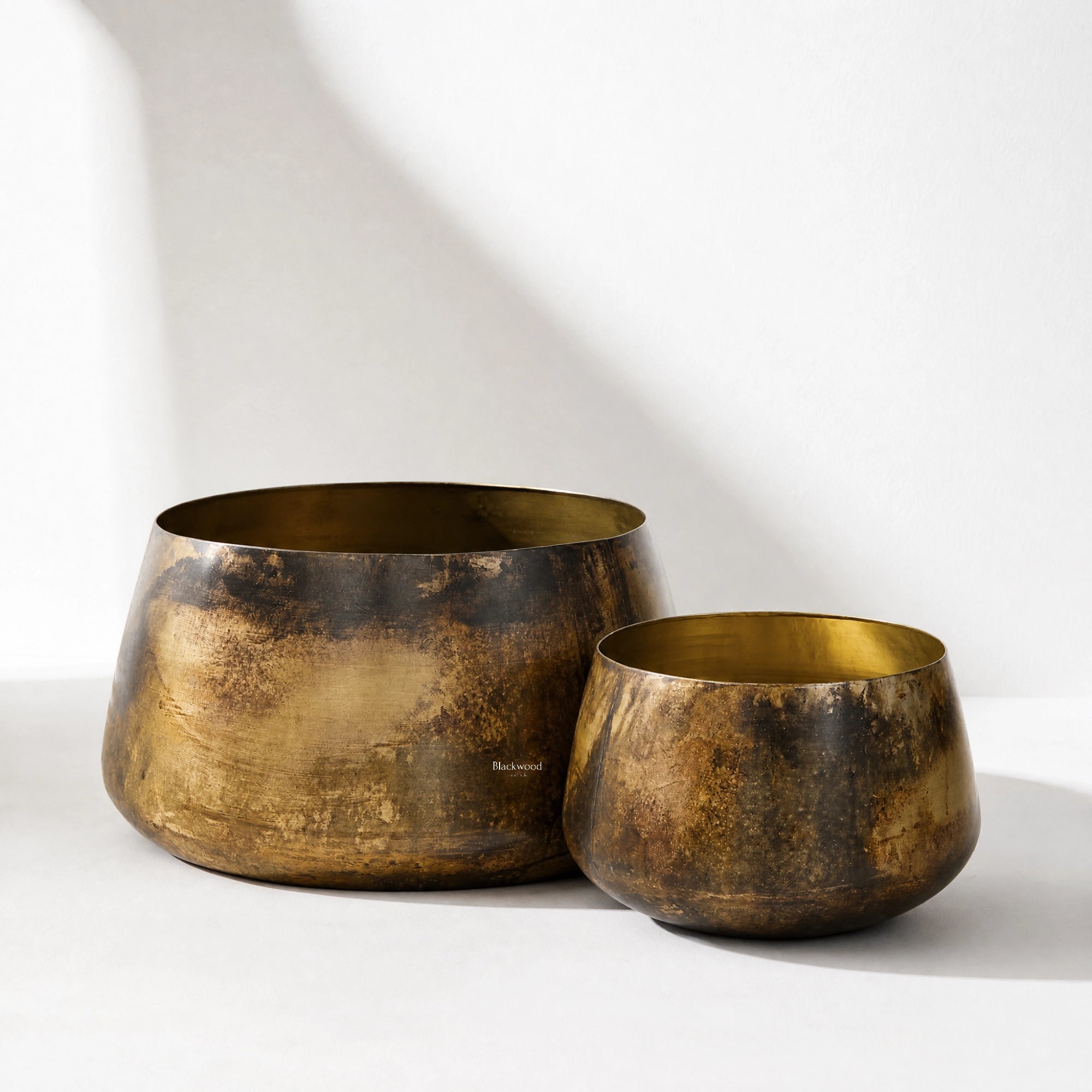 Jaipur Planters Set/2: pair of handcrafted iron planters in antiqued gold with a softly aged patina.