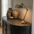 Ravenswood Hall Table in dark, textured reclaimed oak with a brass lamp and ceramic vases.