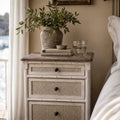 Laguna Bedside Table in weathered white with woven drawer fronts, coastal Hamptons-inspired style.