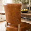 Beaumont Dining Chair - Vintage Tan top-grain South American leather with brass studs.