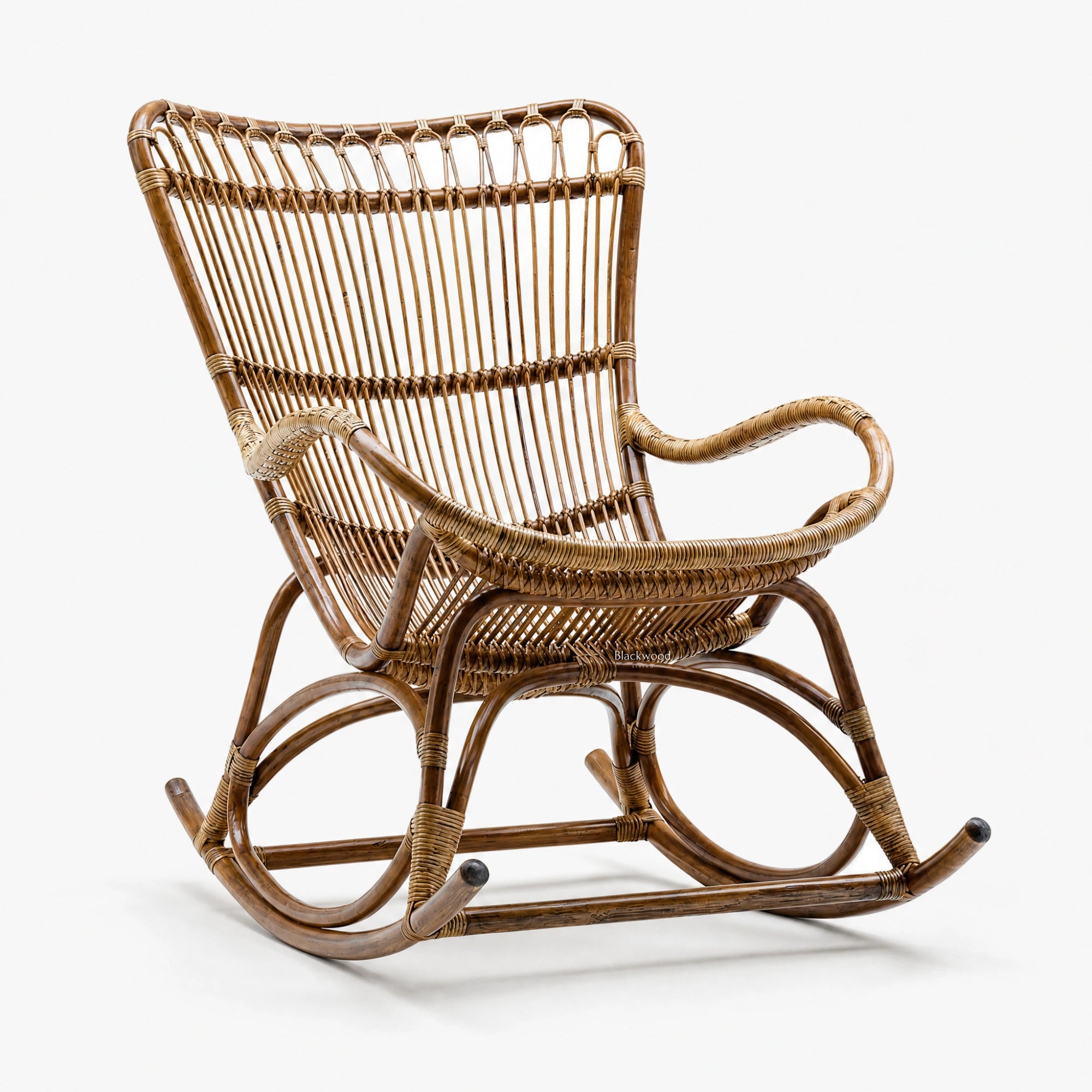 Sika Originals Monet Rattan Rocking Chair in natural rattan with curved arms.