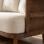 Seabrooke 2-Seat Sofa featuring linen upholstery, solid oak frame, and woven rattan detailing.