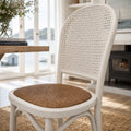 Whitehaven Dining Chair with a white finish and woven cane back and seat, coastal handcrafted style.