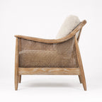 Devonport Chair with ash frame, whitewashed finish, natural rattan detailing, caned back, and upholstered cushions.