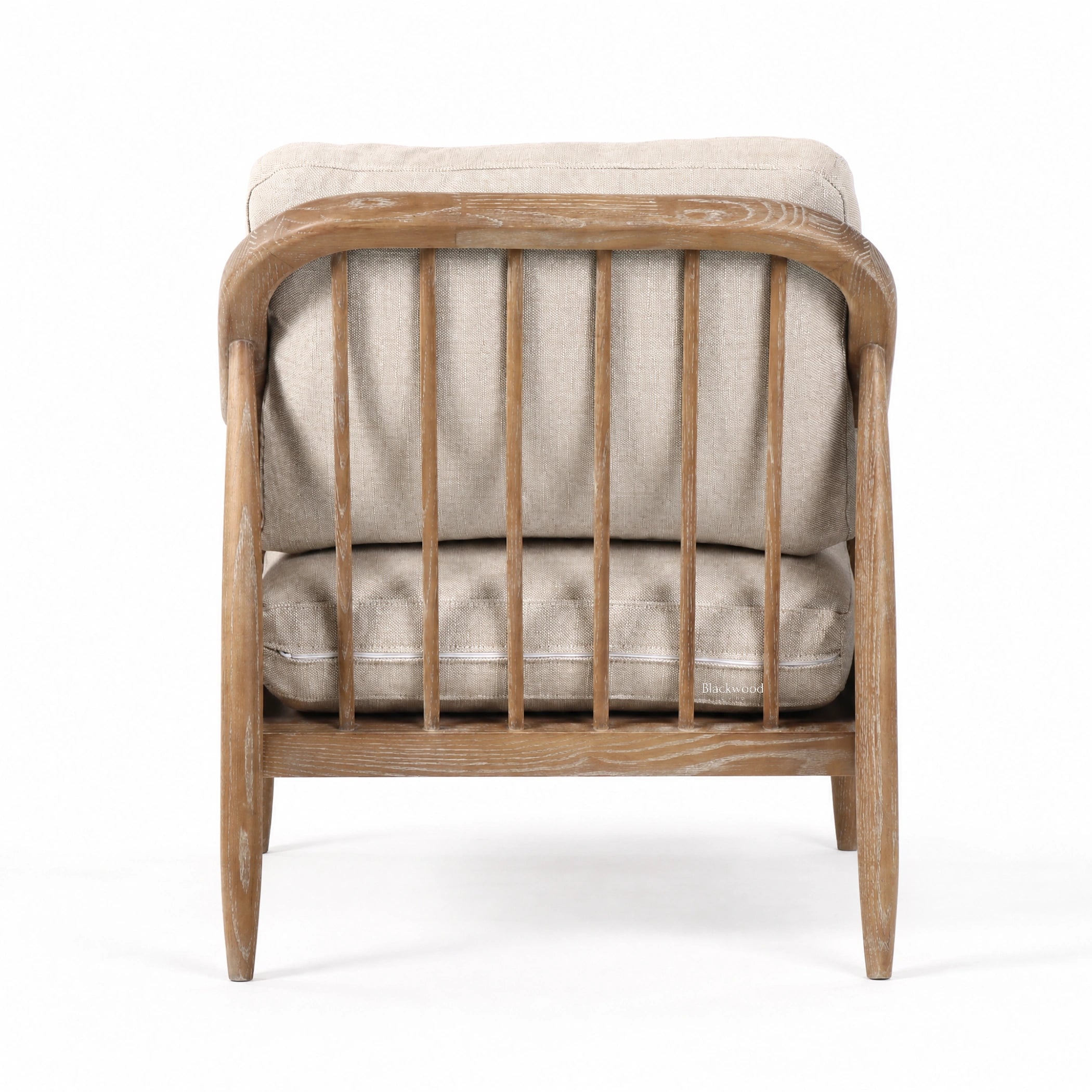 Devonport Chair with solid ash, soft whitewashed finish, natural rattan detailing, and generously upholstered cushions.