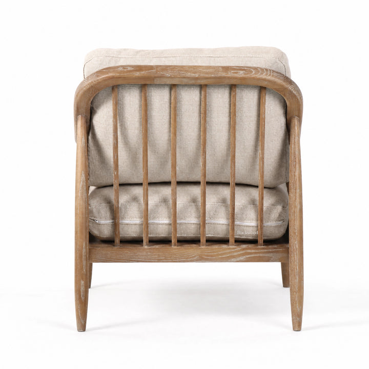 Devonport Chair with solid ash, soft whitewashed finish, natural rattan detailing, and generously upholstered cushions.