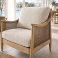 Devonport Chair in solid ash with a whitewashed finish, coastal rattan detailing and plush upholstered cushions.