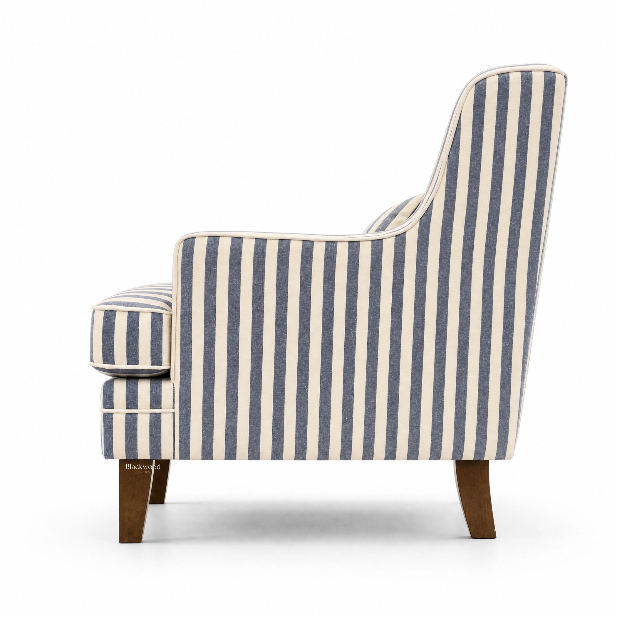 Southport Chair in navy and beige striped upholstery, cushioned seat, curved arms, wooden legs.