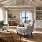 Southport Chair with striped upholstery, plush cushions, and softly curved silhouette in a sunlit coastal living room.