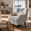 Southport Chair with striped upholstery and plush cushioning in a sunlit coastal living room