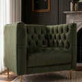Wellington Club Chair - Green Velvet, with deep button tufting and gold legs, in luxe living room beside a fireplace.