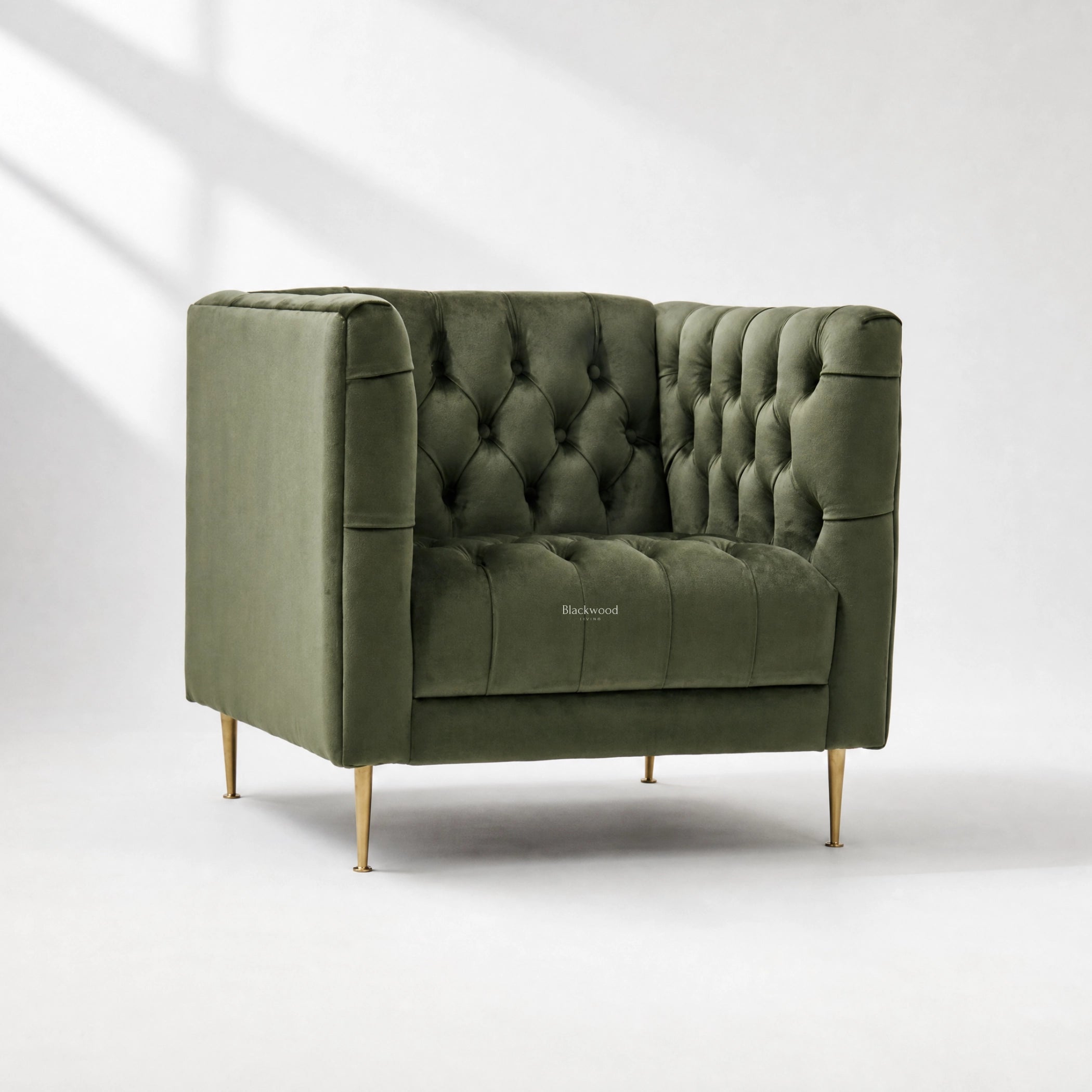 Wellington Club Chair - Green Velvet with deep button tufting and gold legs.