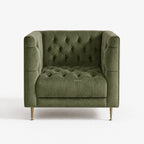 Wellington Club Chair in green velvet with deep button tufting and curved arms, brass legs.