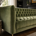 Wellington Club Sofa in rich green velvet with deep button tufting along seat, back, and arms.