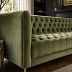 Wellington Club Sofa in rich green velvet with deep button tufting along seat, back, and arms.
