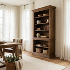 Wycliffe Bookcase in textured recycled pine with open shelves holding pottery, books, and baskets.