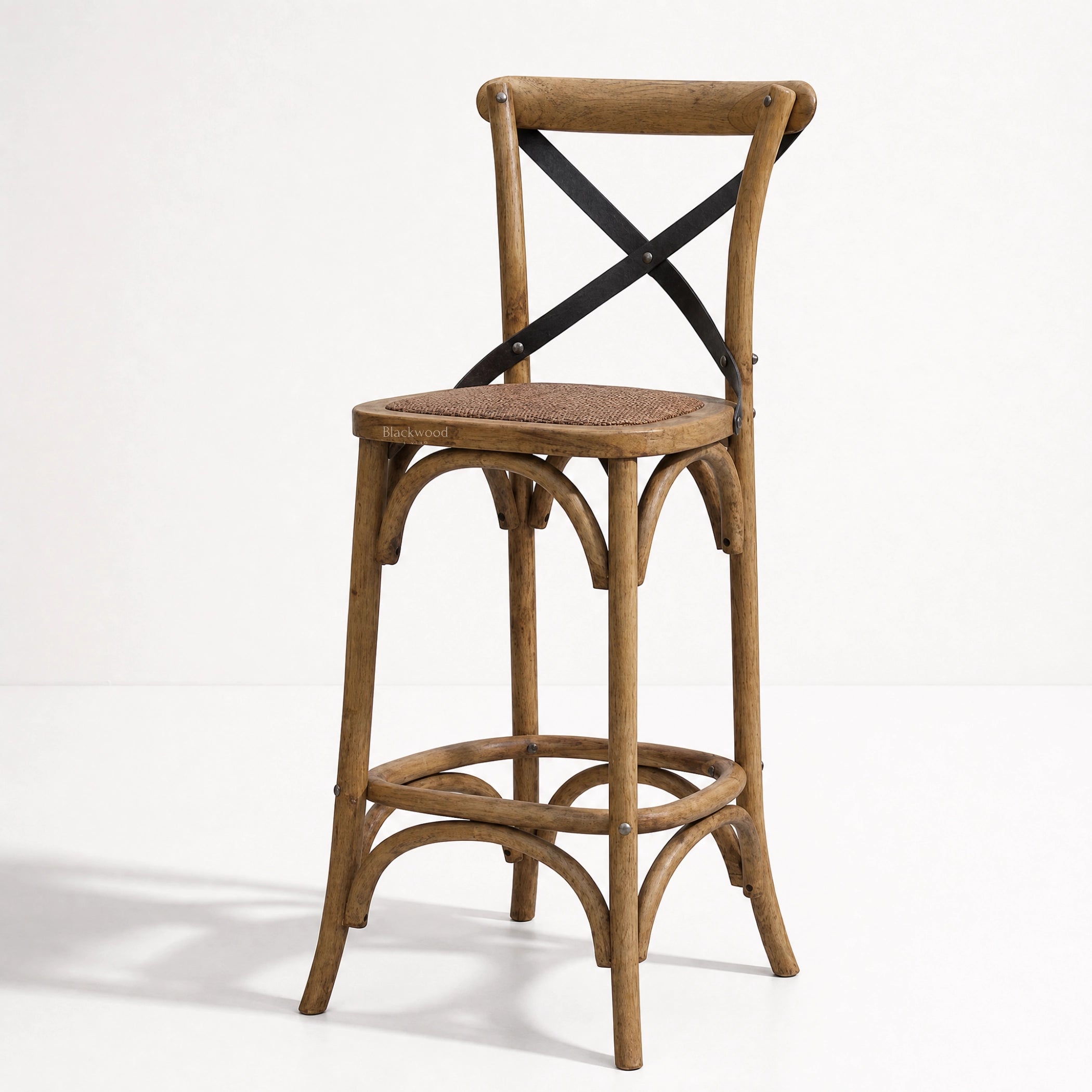 Provence Counter Stool in aged oak with a woven cane seat and black metal X-back supports.