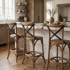 Provence Counter Stool in old oak with woven rattan seat around a marble kitchen island.