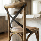 Provence Counter Stool in aged oak with woven rattan seat and black metal X-brace