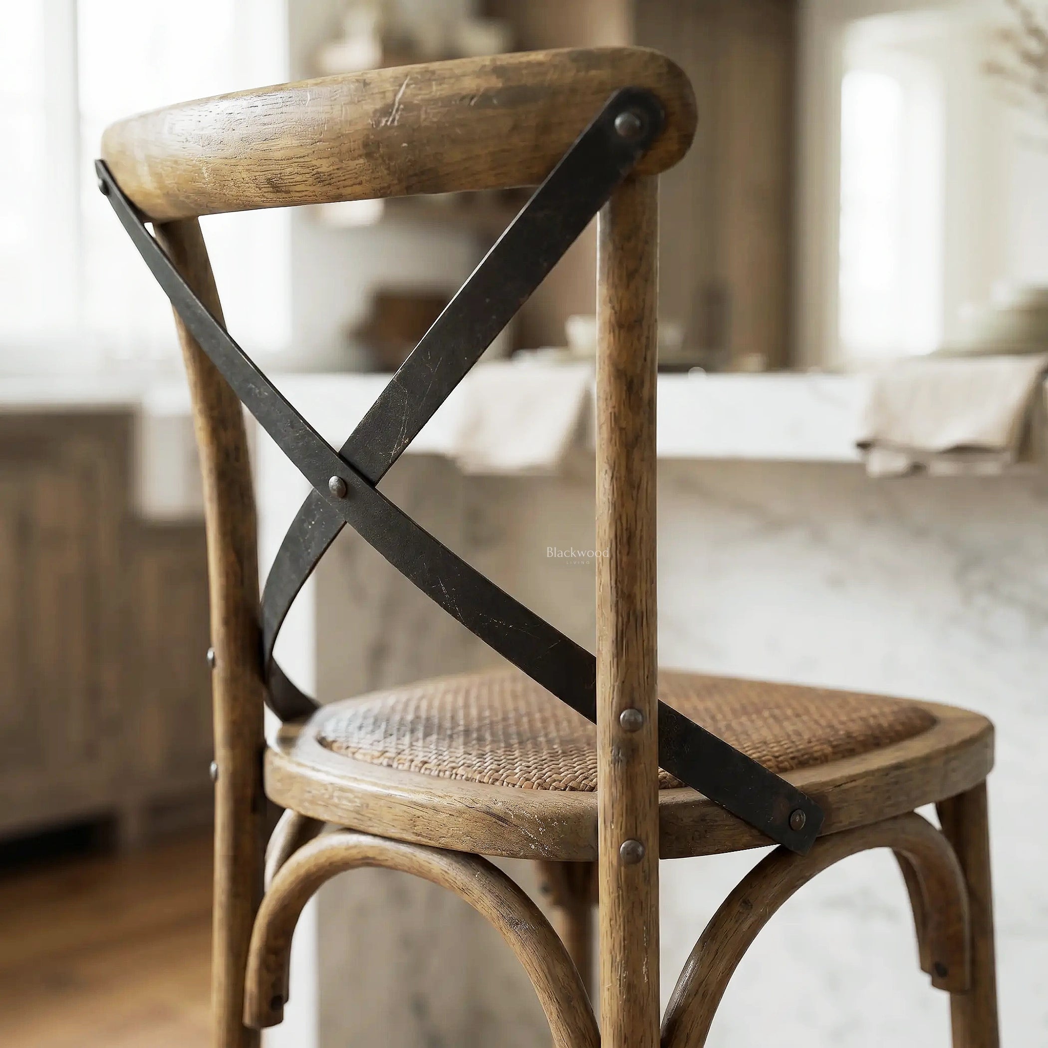 Provence Counter Stool in aged oak with woven rattan seat and black metal X-brace