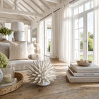 Ceramic Urchin sculpture on a wooden table in a sunlit, coastal-inspired living room.