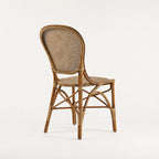 Sika® Rossini Rattan Side Chair with woven back and seat in natural brown rattan.
