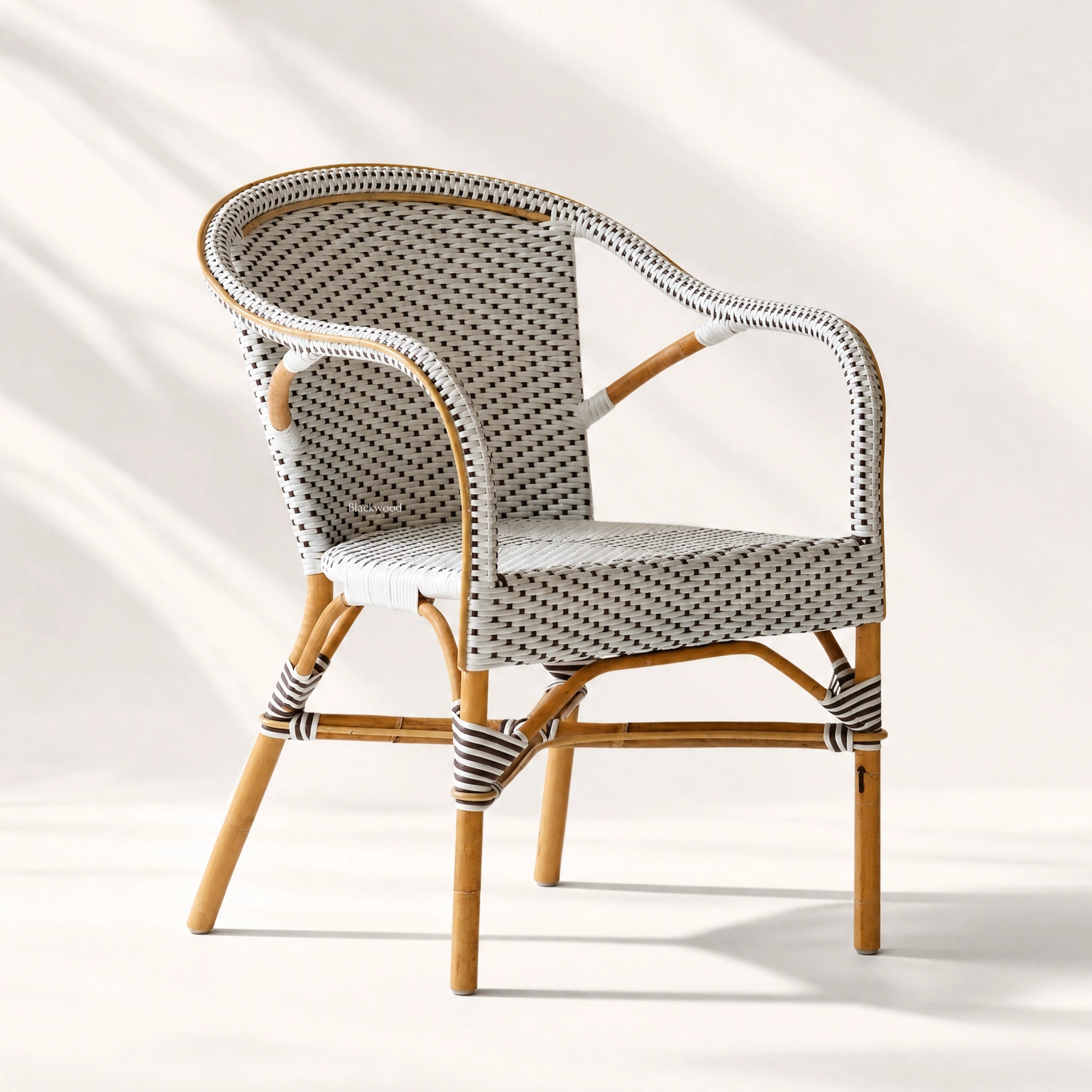 Sika® Affair Madeleine Rattan Armchair with natural rattan frame and woven ArtFibre detailing.