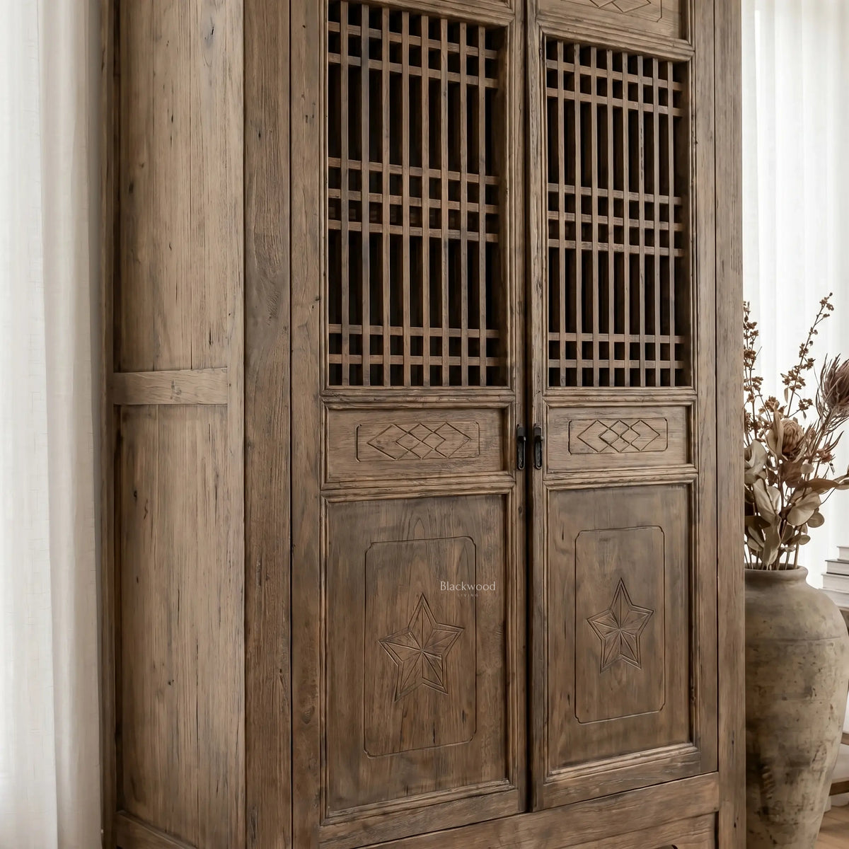 Eastwind Cabinet in weathered reclaimed elm with lattice doors and sturdy, timeless design