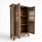 Eastwind Cabinet in weathered elm with lattice panels and interior shelving.