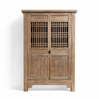 Eastwind Cabinet in weathered elm with lattice doors and diamond-carved panels.