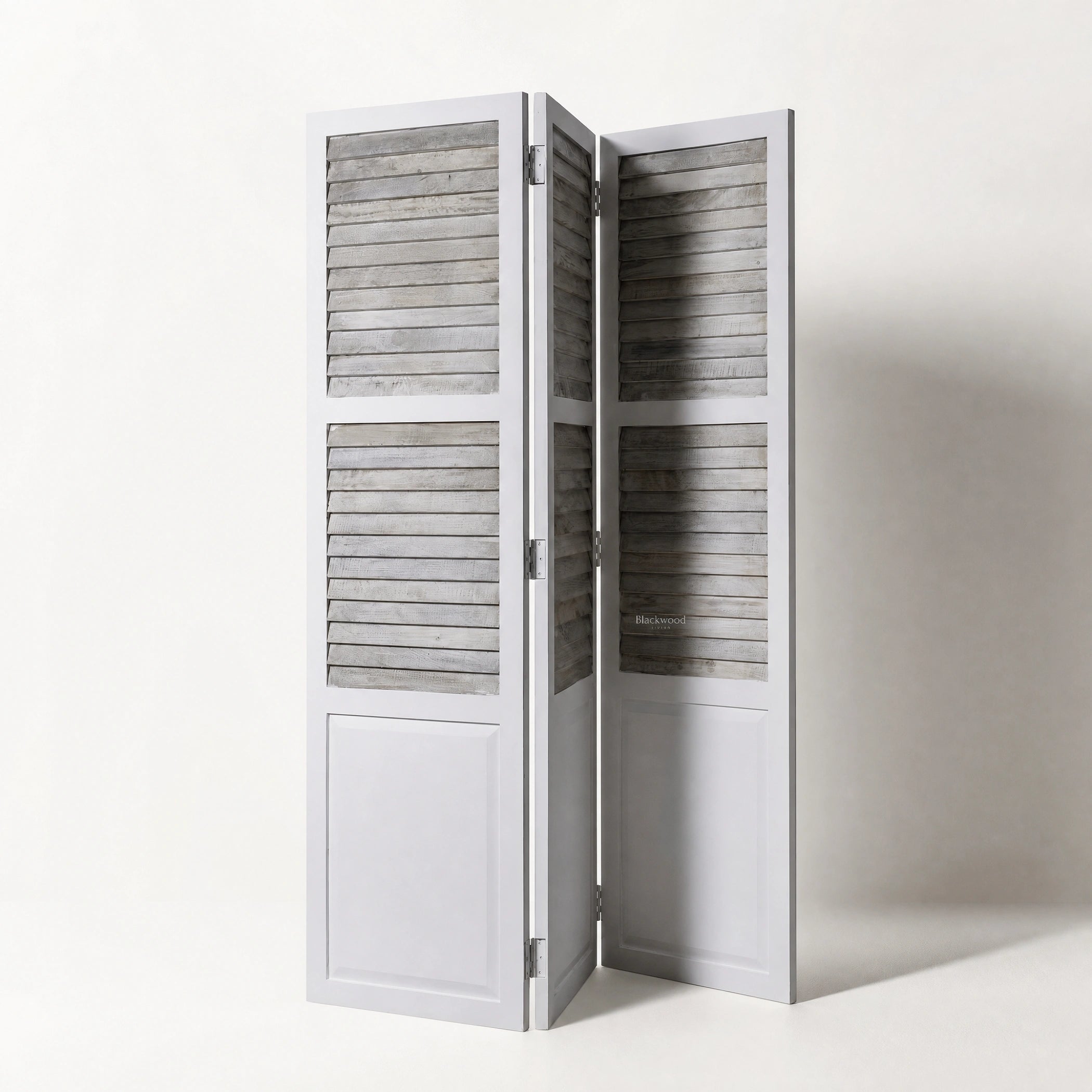 Whitehaven Room Divider in distressed antique white mango wood with hinged louvered panels.